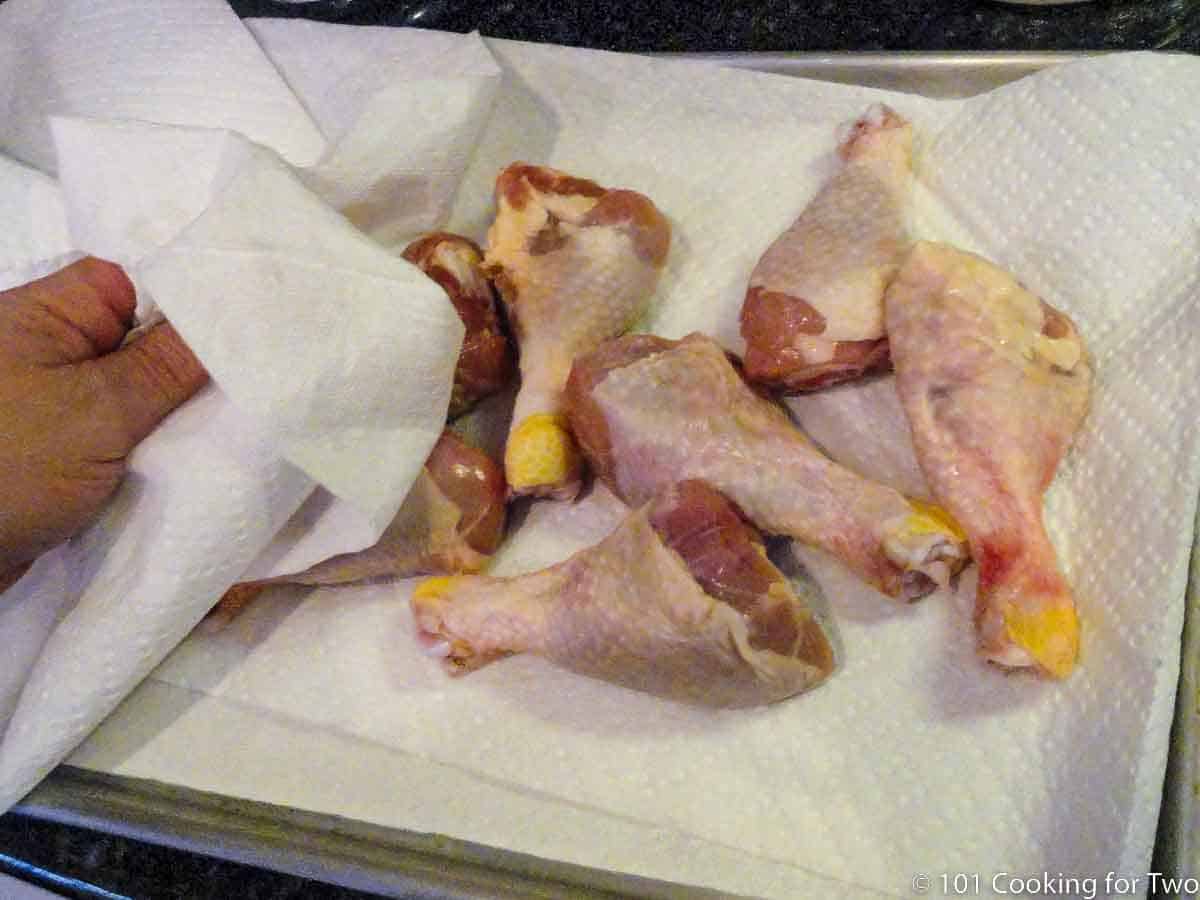 pat chicken drumsticks with paper towels