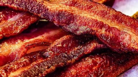 https://www.101cookingfortwo.com/wp-content/uploads/2022/10/pile-of-cooked-bacon-on-white-plate-480x270.jpg