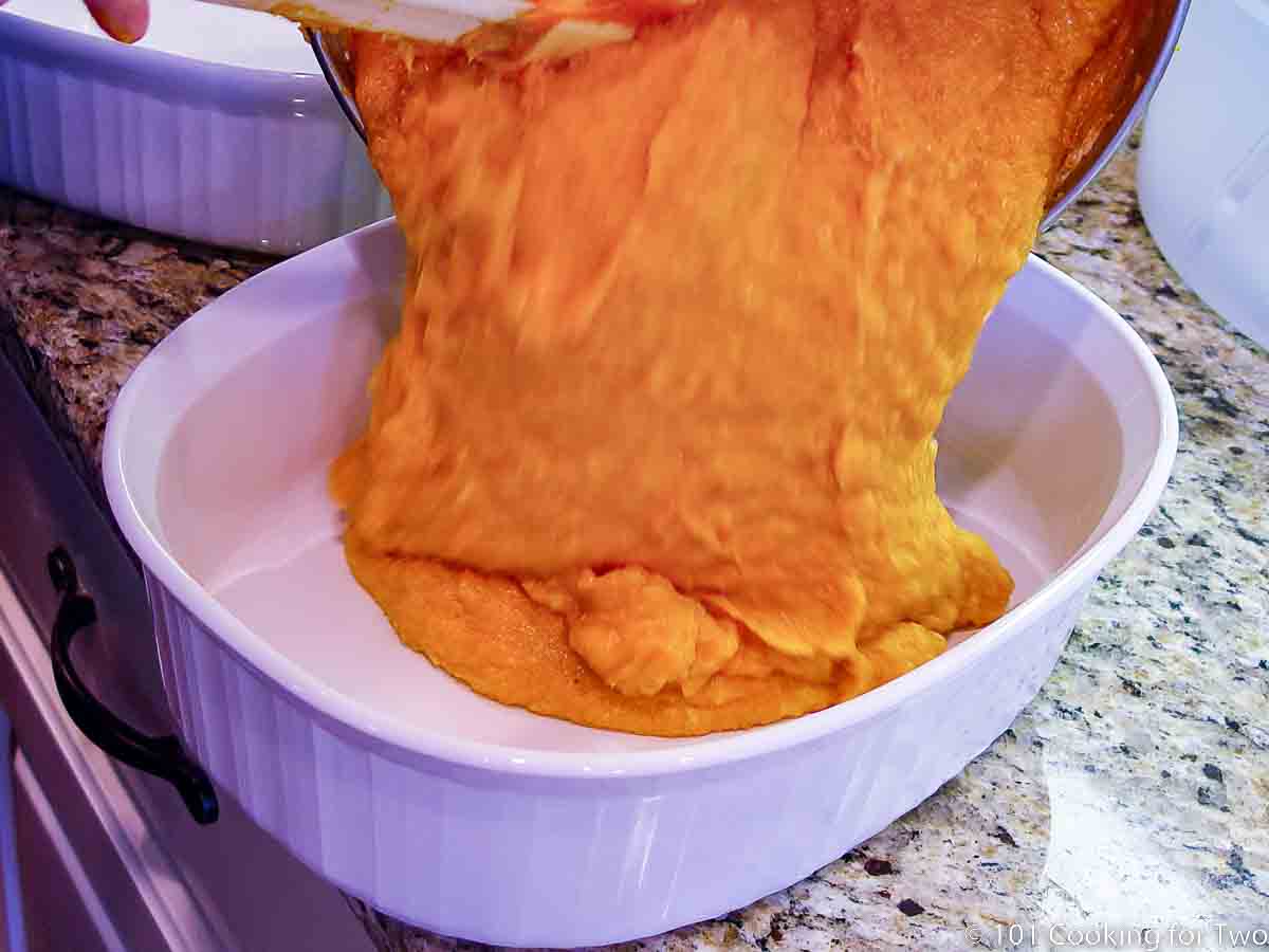 pouring sweet potato mixture into white bowl.