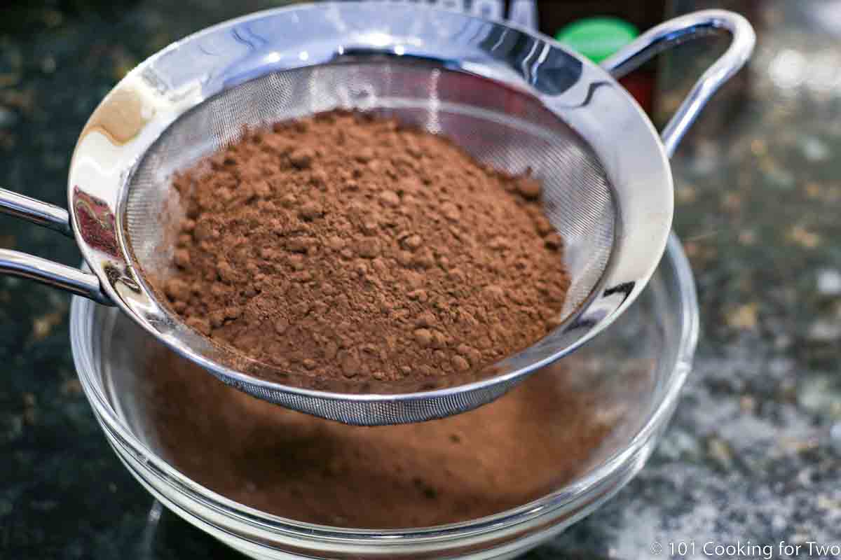 sitfing cocoa powder through strainer.