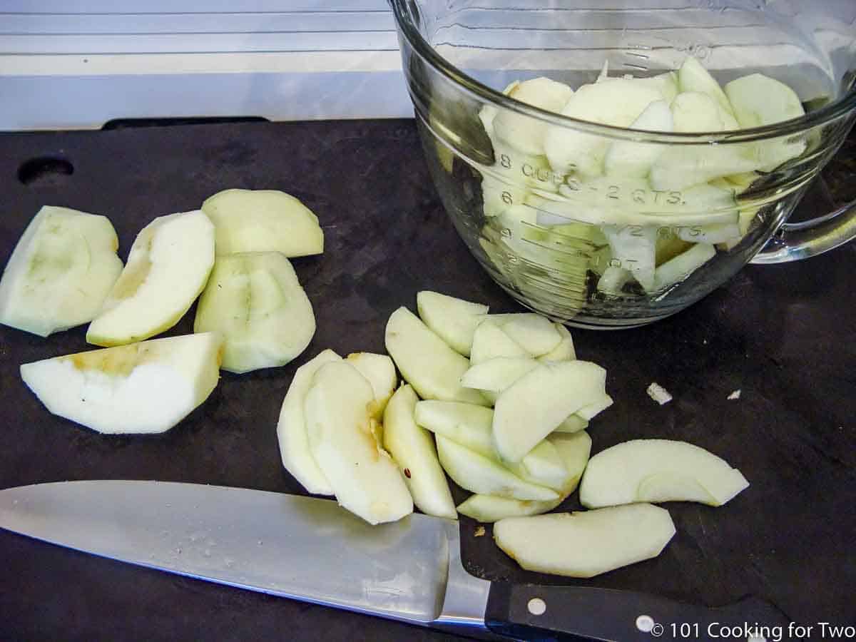 slicing apples after pealing.