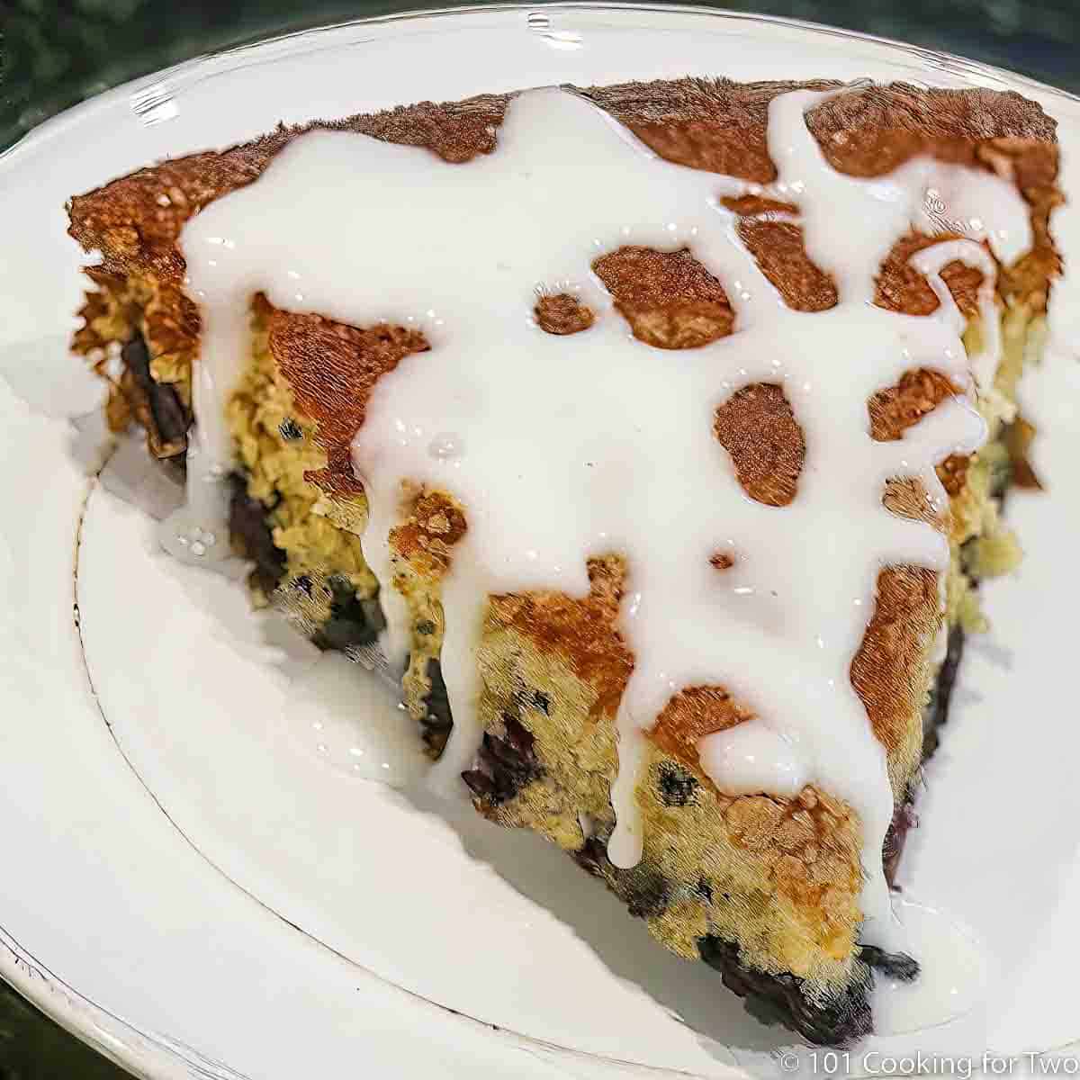 Blueberry cake on white plate.