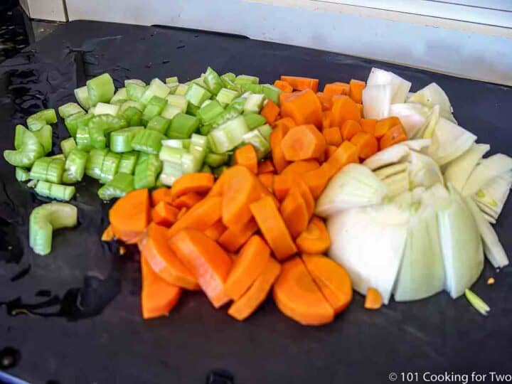 chopped vegetables on black board