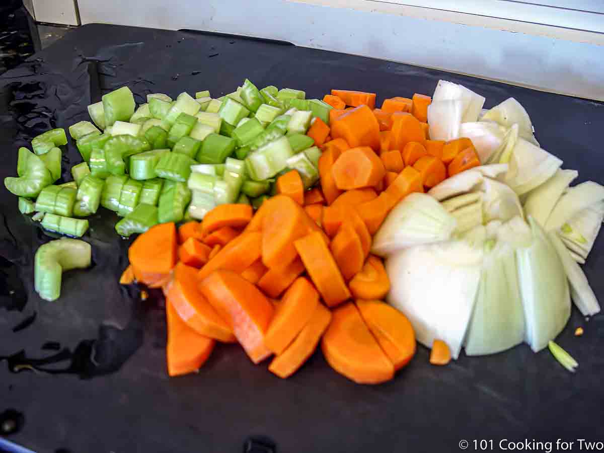 chopped vegetables on black board.