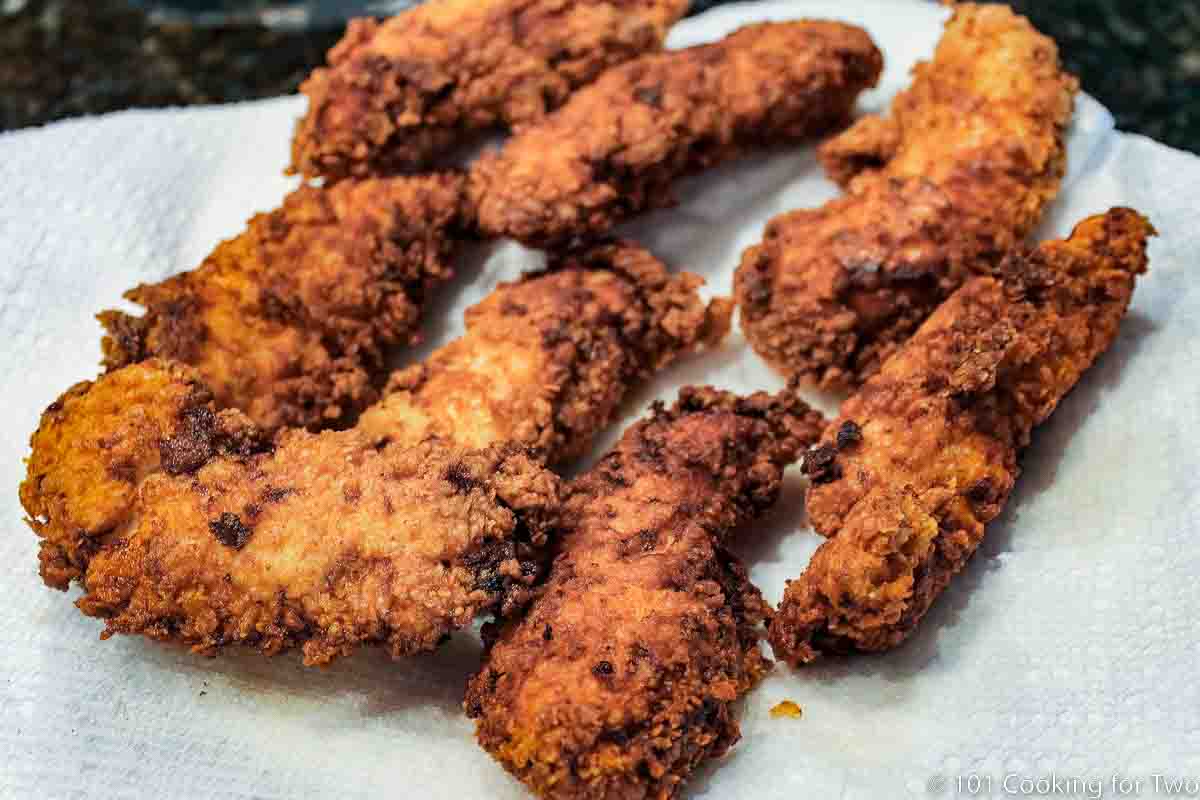 fried tenders on white plate.