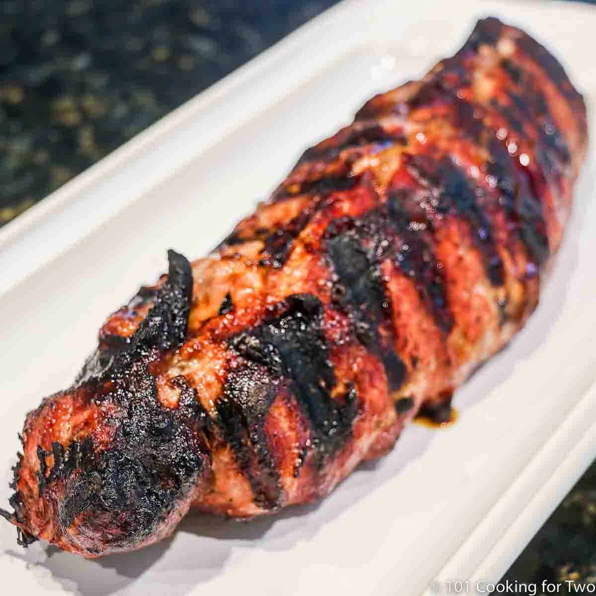 grilled pork tenderloin on white plate