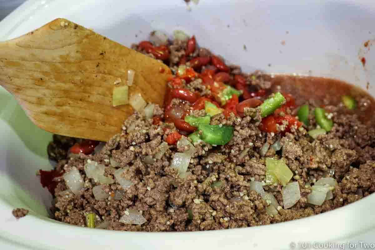 mixing all ingredients in the crock pot.