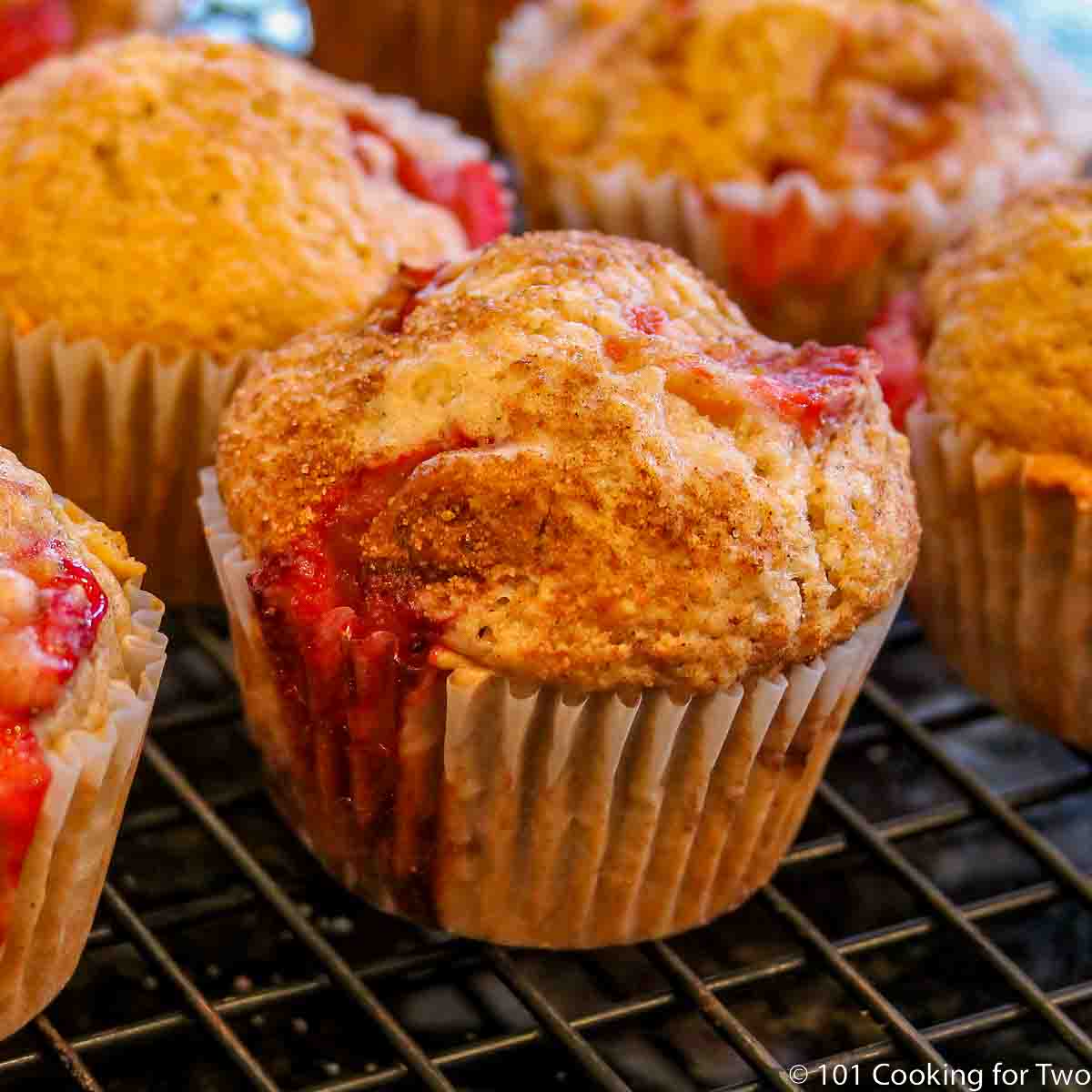 stawberry muffin on a cooling rack.