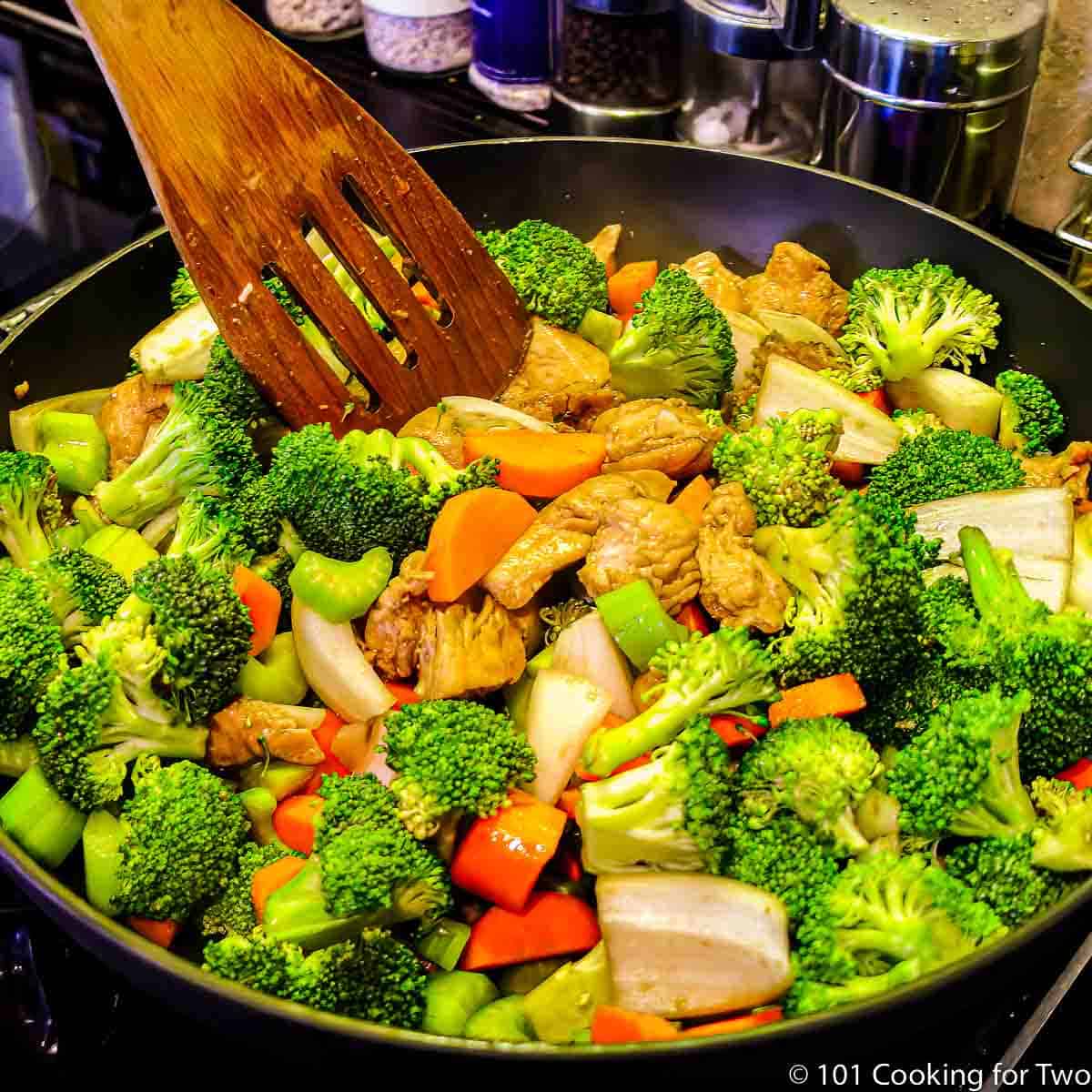 stirring the stir fry.