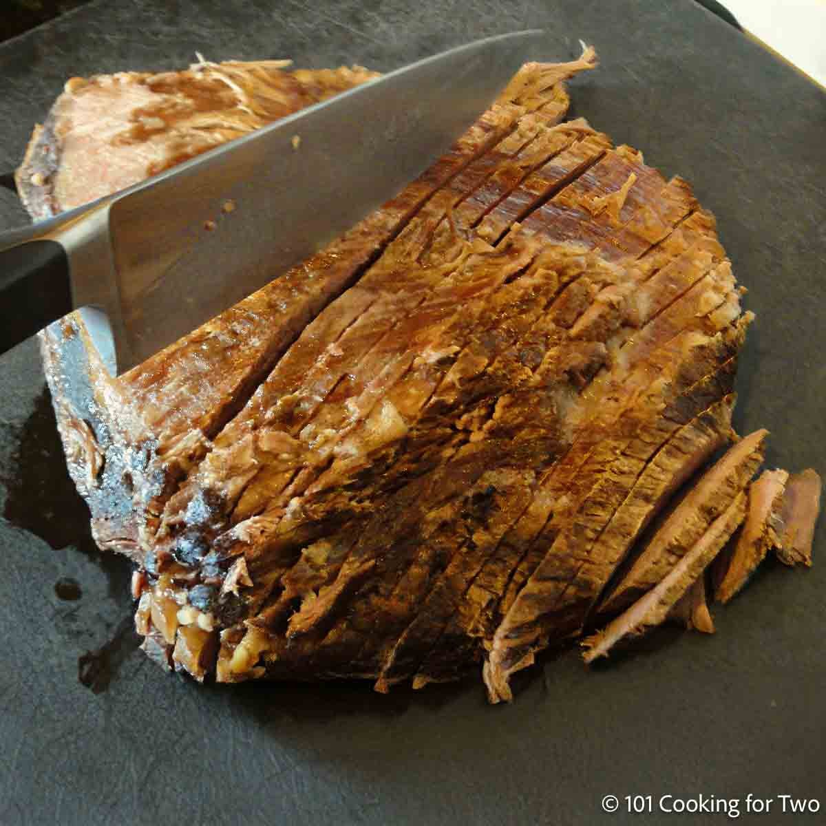 Cutting the brisket.