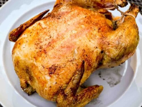 https://www.101cookingfortwo.com/wp-content/uploads/2023/01/Grilled-whole-chicken-on-a-gray-plate-2-500x375.jpg