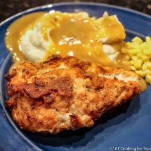 Oven fiied chicken on a blue plate