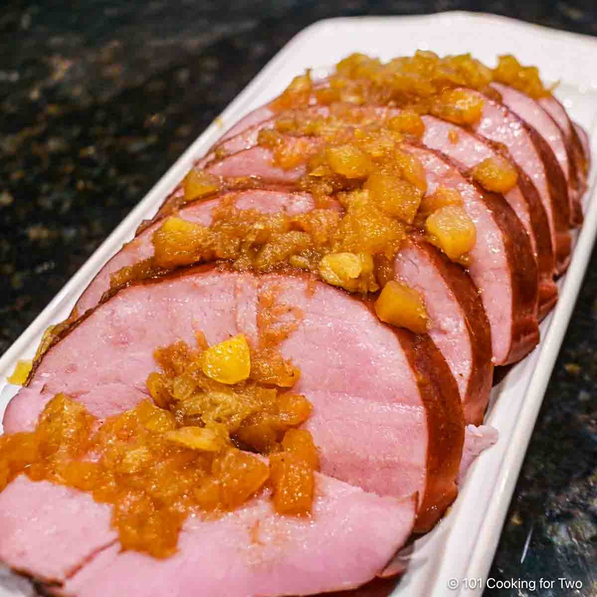 Slices of ham with pineapple honey glaze.