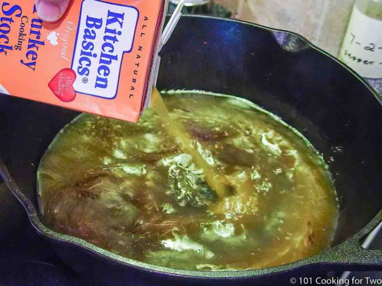 adding turkey stock to pan for gravy