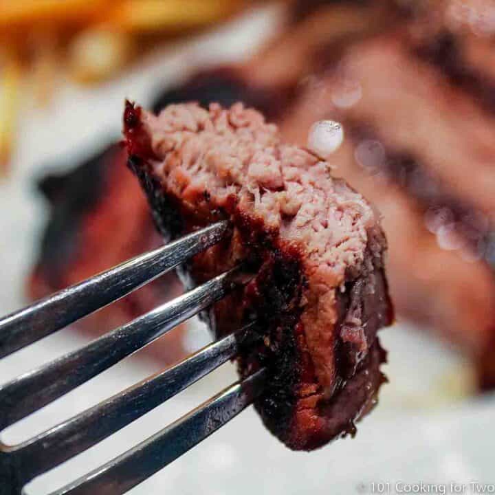 bite of steak on a fork