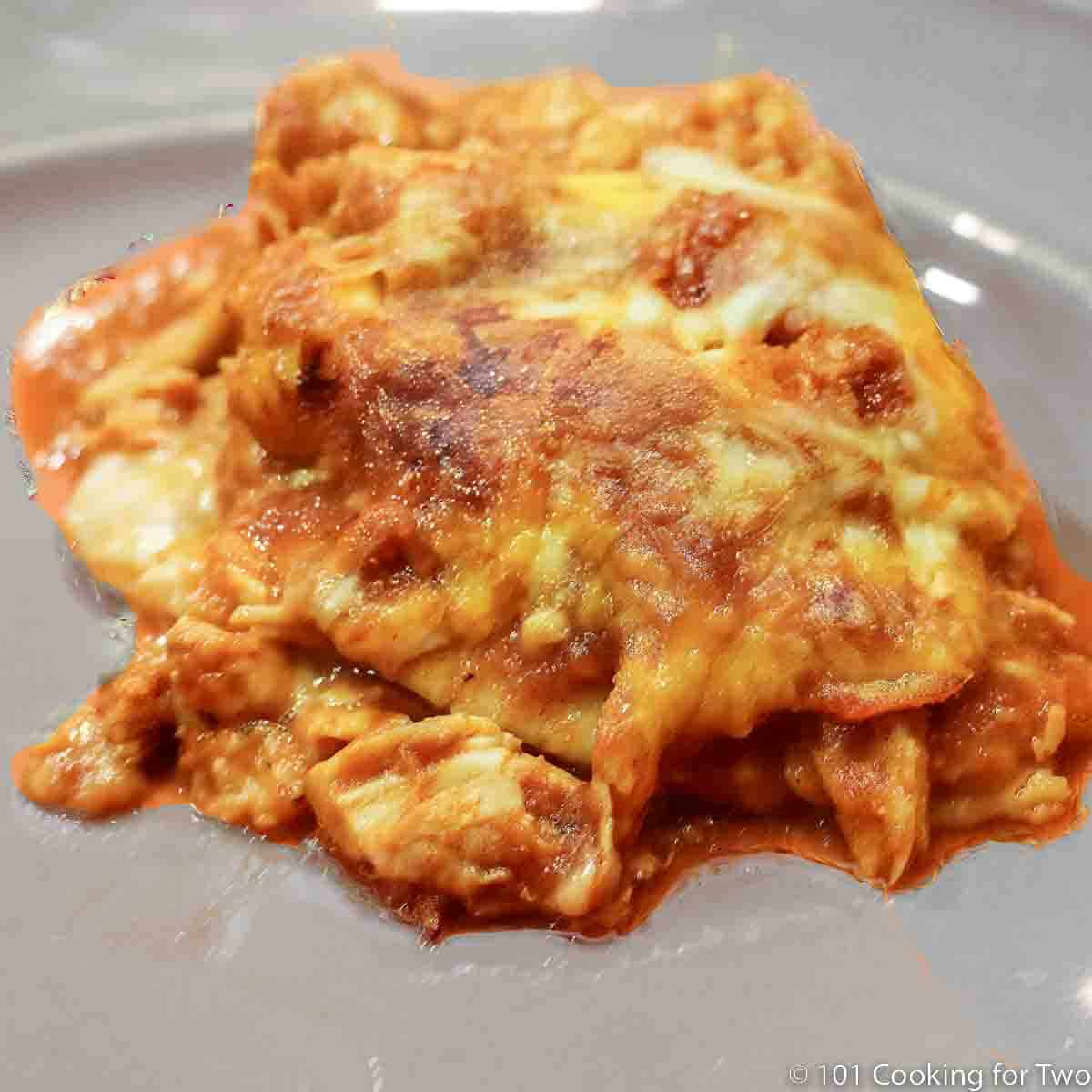 chcken enchilada casserole casserole on a gray plate