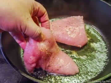 laying turkey tenderloins in pan with hot butter