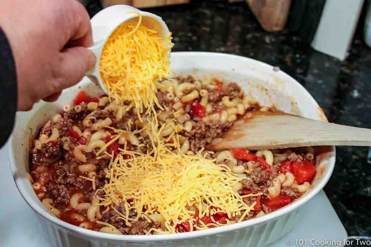 mixing cheese into casserole.