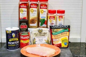 raw chicken with enchilada ingredients