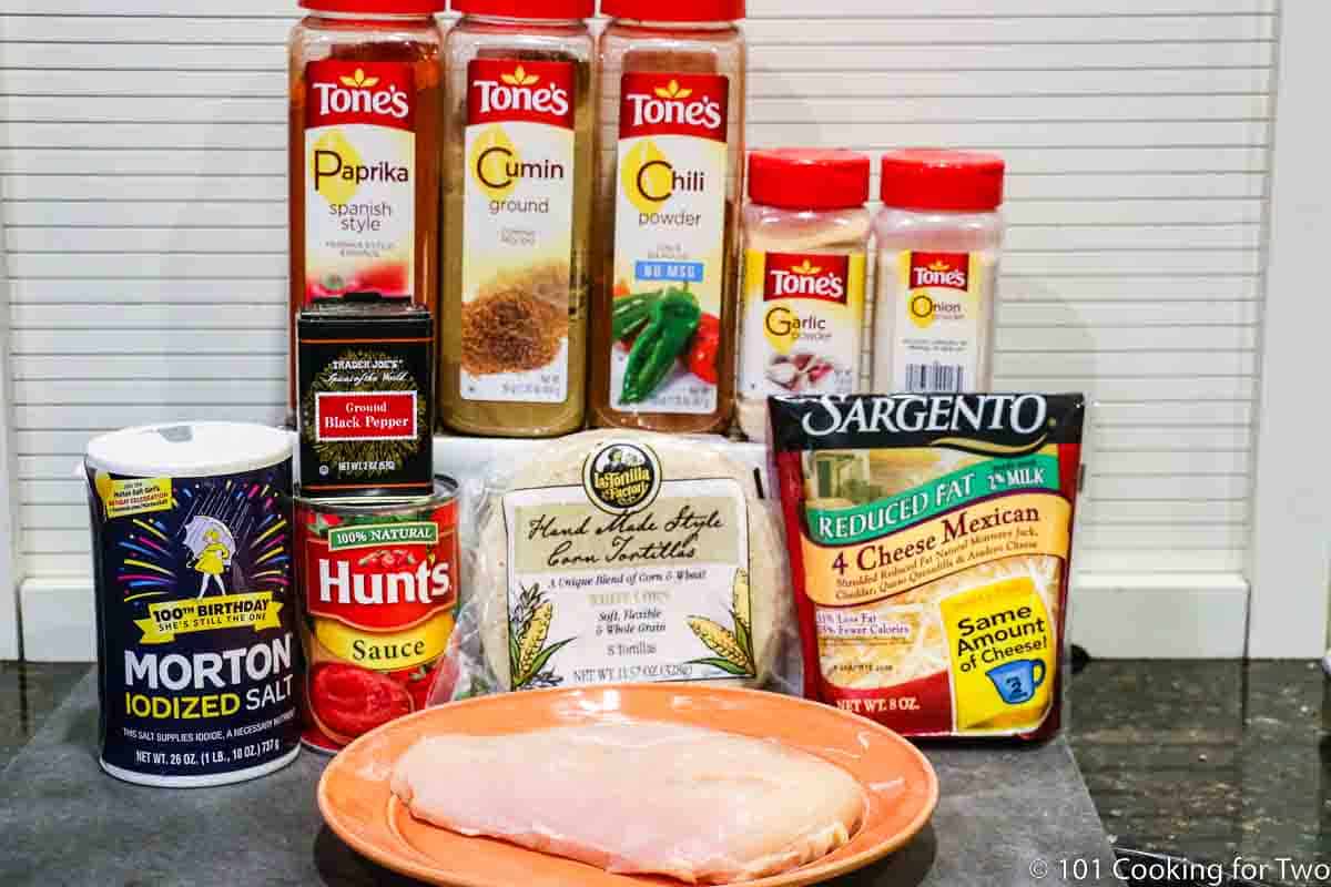 raw chicken with enchilada ingredients