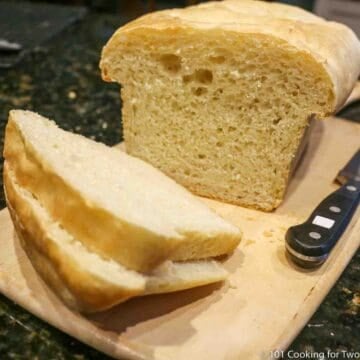 loaf of bread sliced on a board