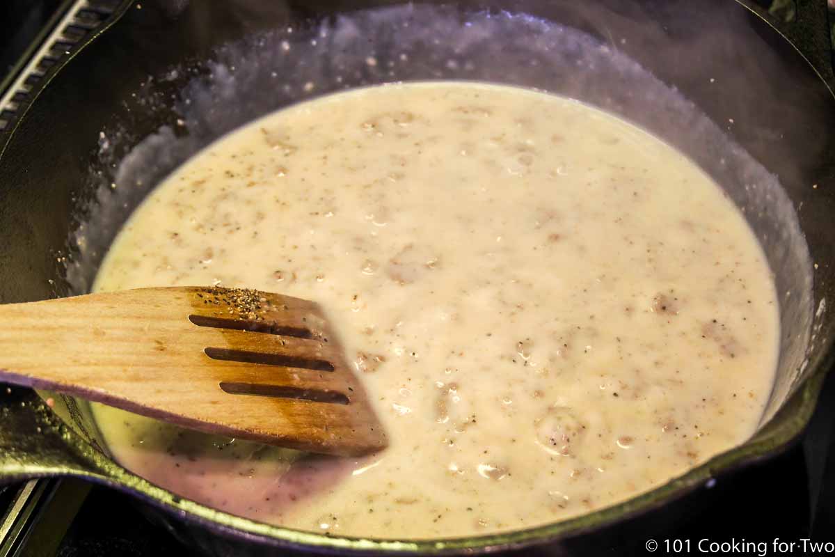 stirring sausage gravy to thicken.