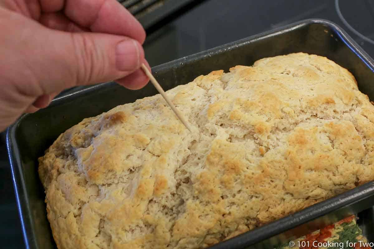 toothpick coming out clean from baked beer bread.