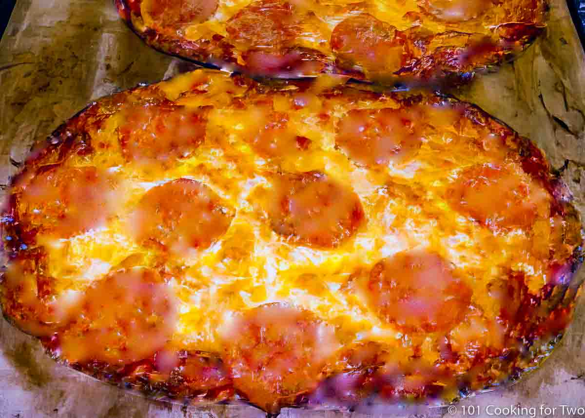 tortilla pizza on a pizza stone