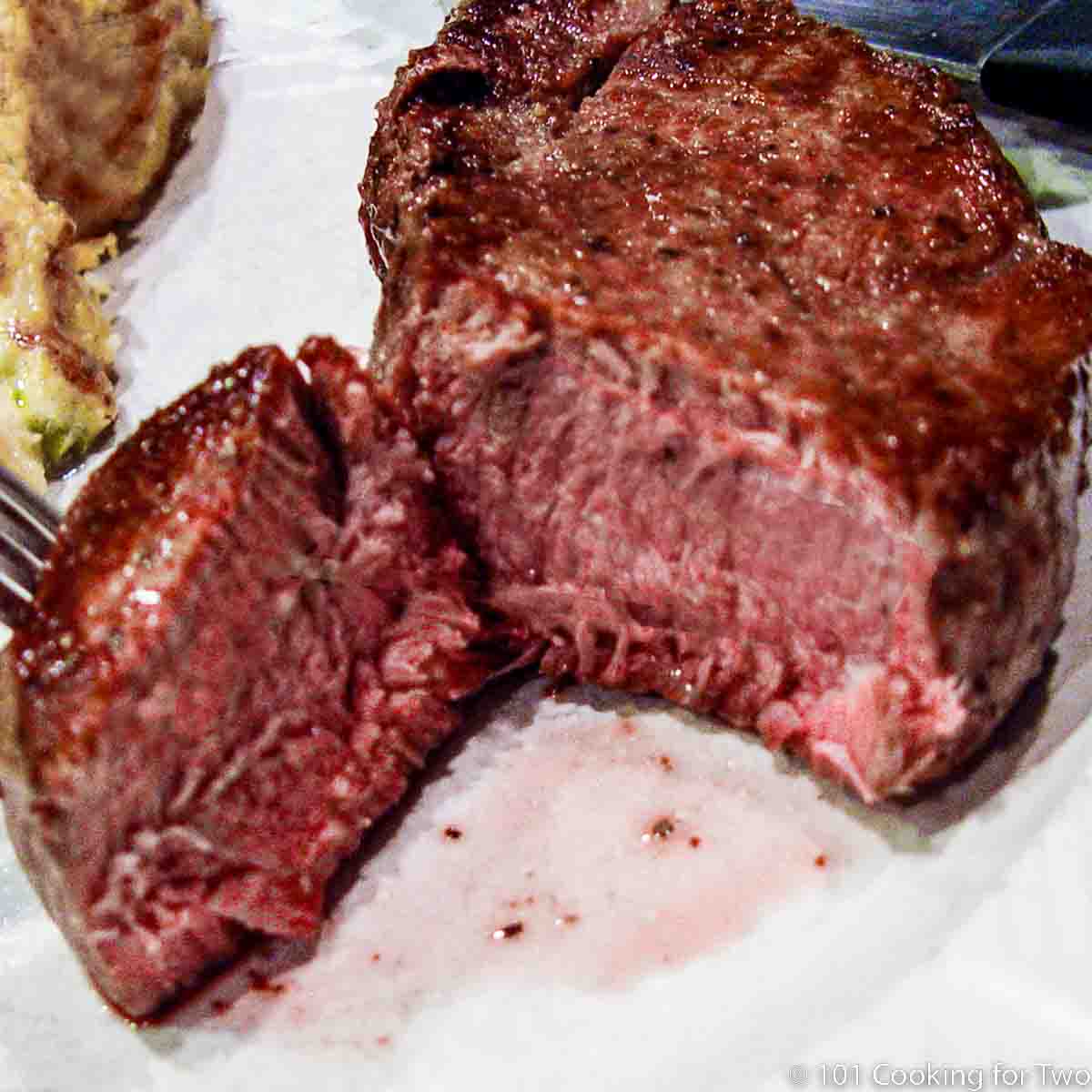 cut filet on a white plate.