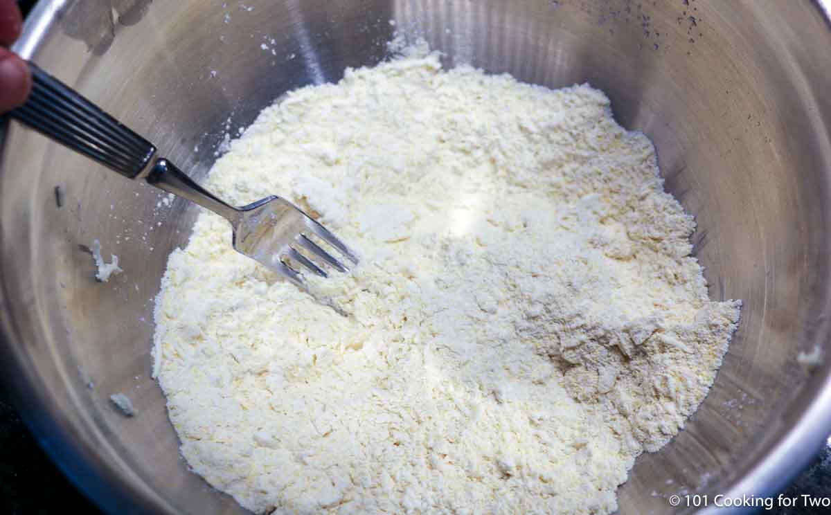 cutting butter into dry ingredients.
