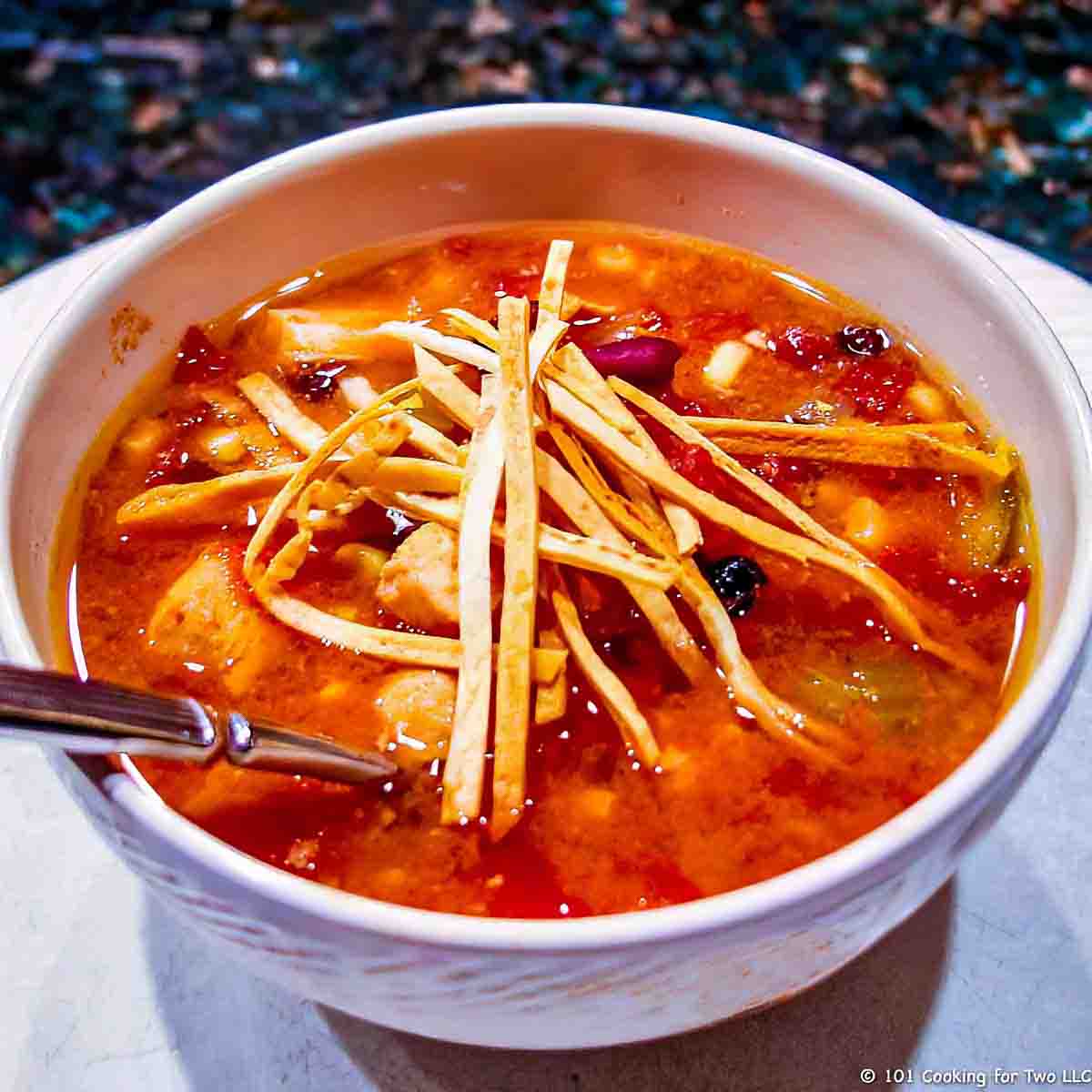 tortilla soup in a white bowl.