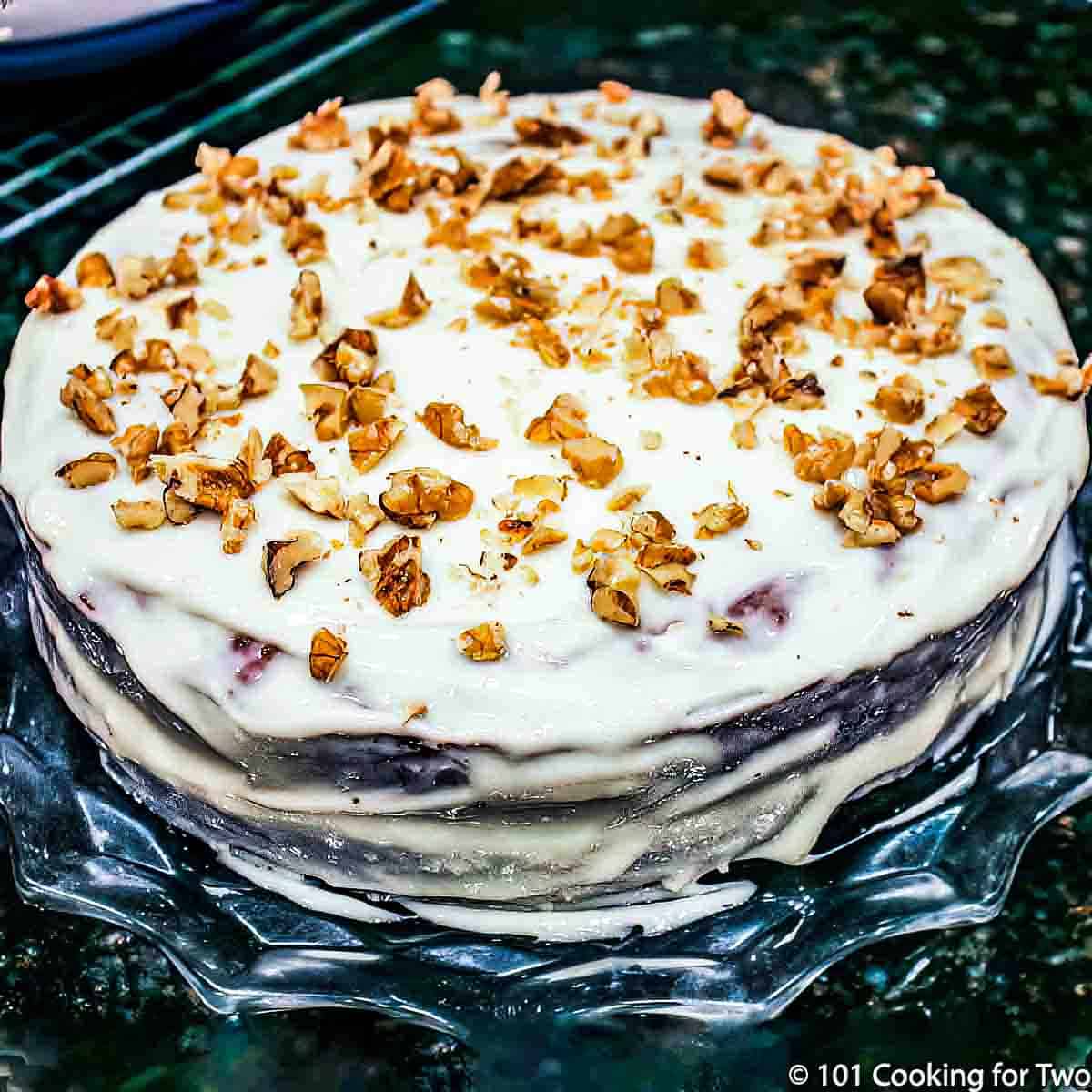 .whole llayered carrot cake with nuts.