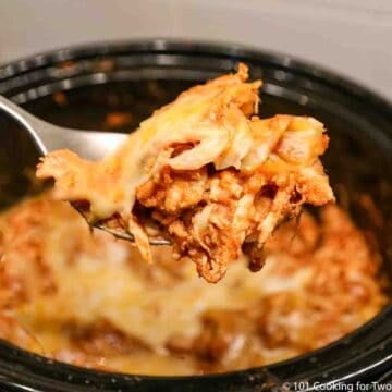 crock pot chicken enchiladas on spoon