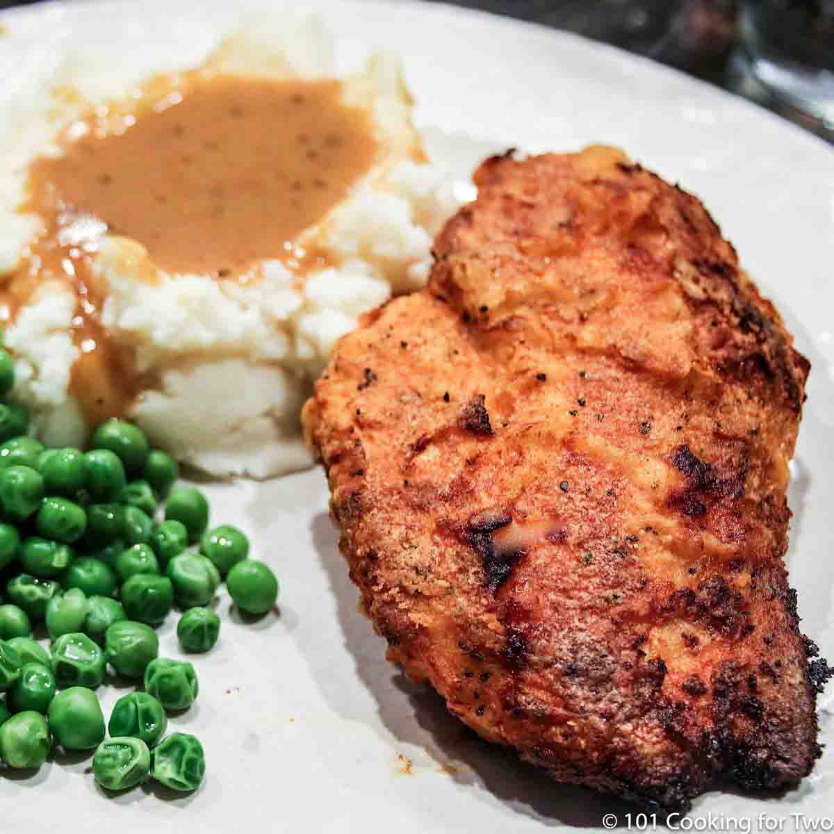 oven fried chicken on a white plate.