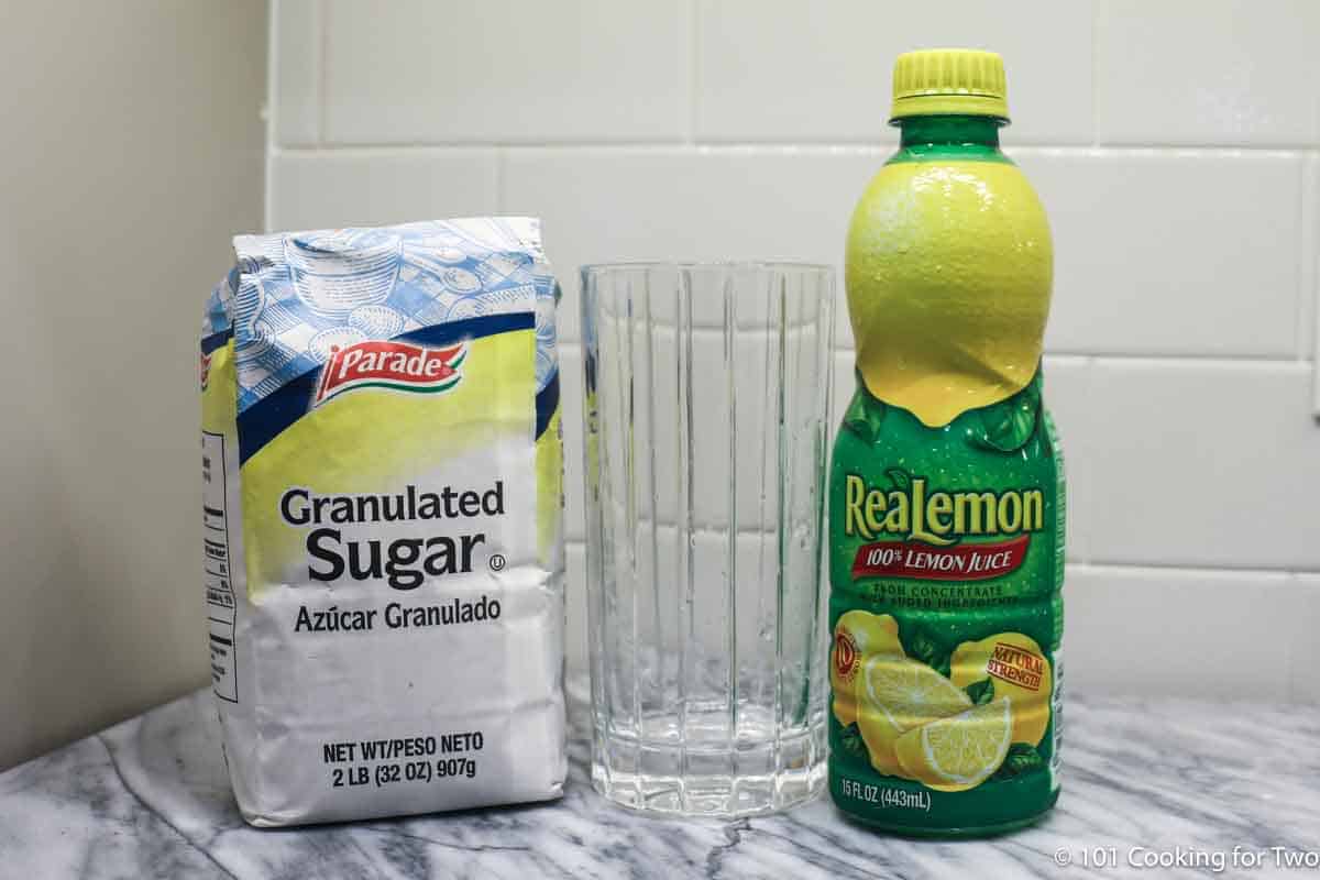 lemon juice with sugar and a glass.
