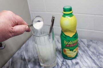 pouring sugar into glass