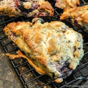 blueberry cream cheese scone on a rack