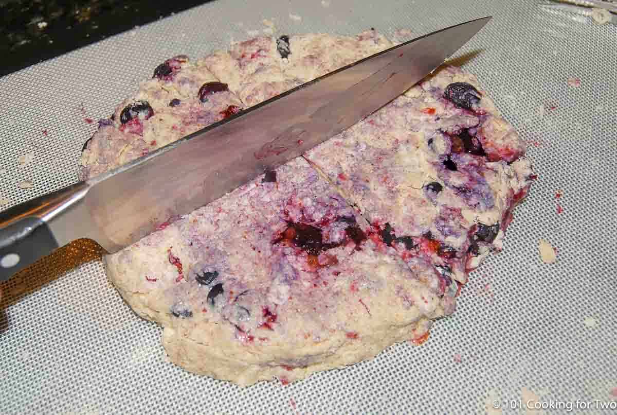 cutting scones with chef knife.