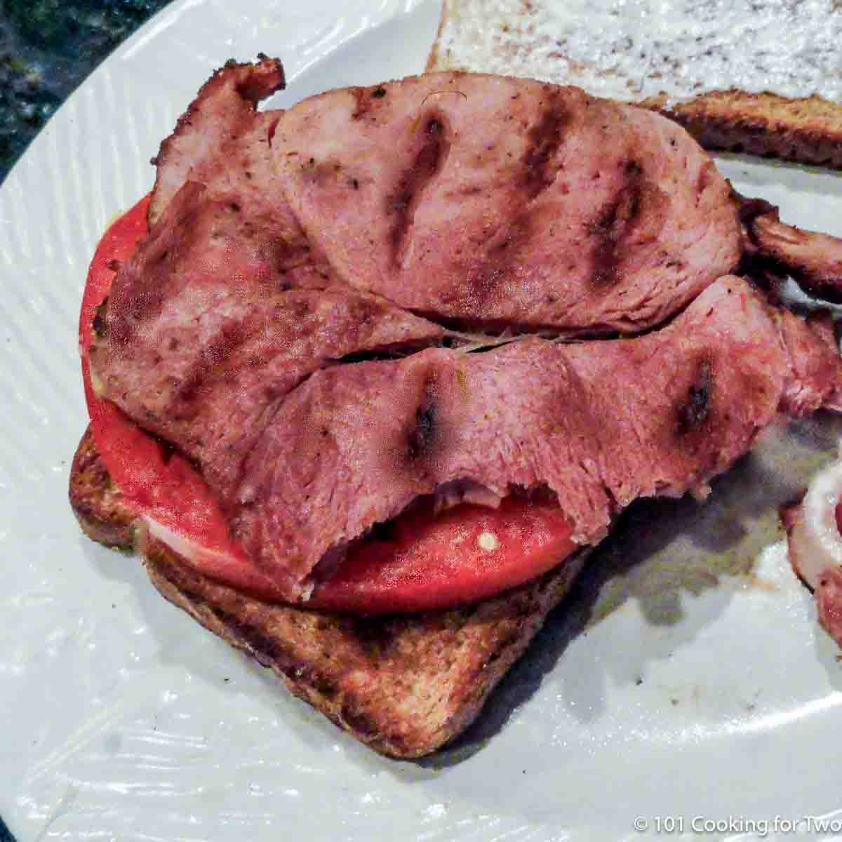 grilled ham steak on a sandwich.