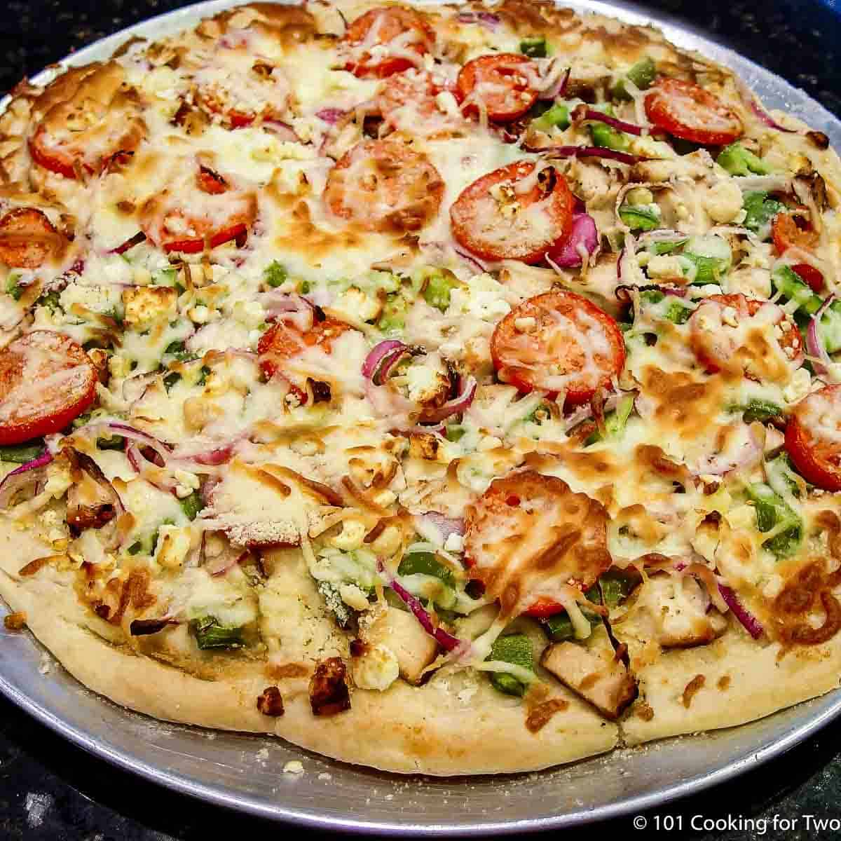whole cooked 4 cheese chicken pizza.