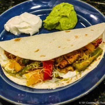 chicken fajita tortilla with sour cream.