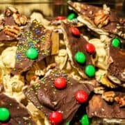 Pieces of Saltine Cracker Toffee with Christmas crack toppings.