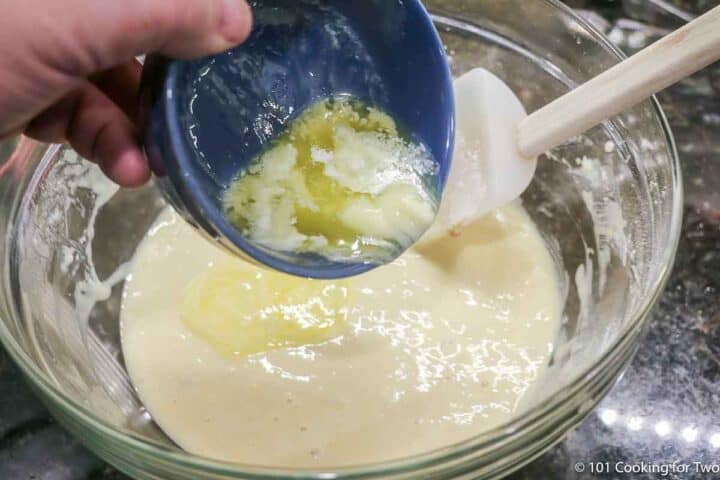 adding melted butter to batter.