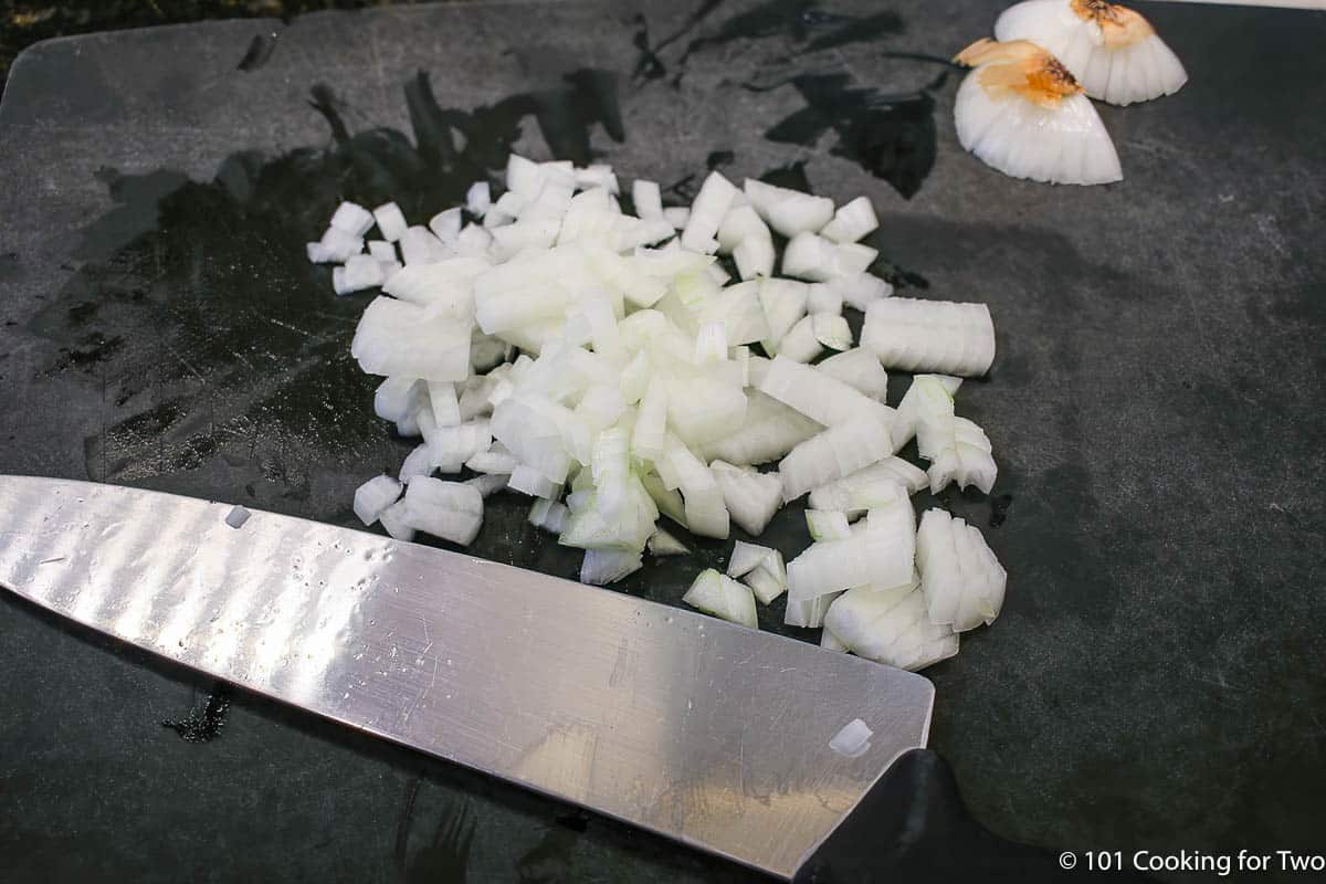 chopped onion with knife.