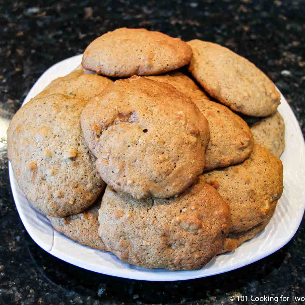 plate of banana cookies with nuts.