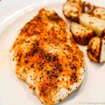 baked chicken breast with roasted potatoes.