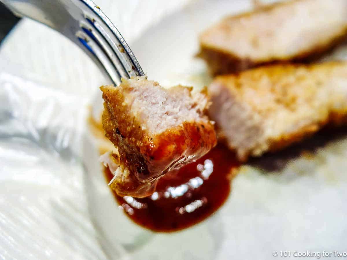bite of bonelsss rib with sauce on a fork.