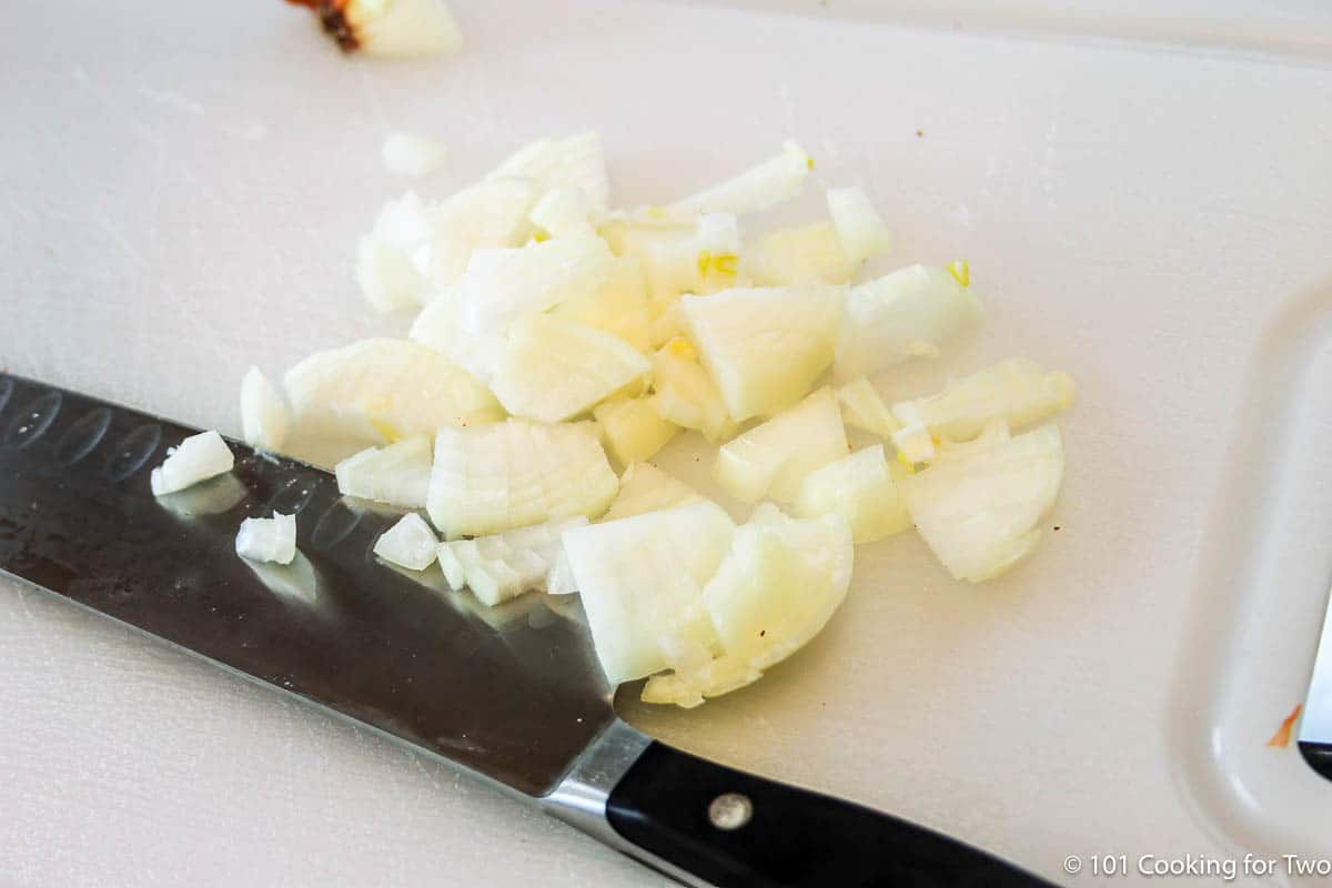 chopped onion with knife.