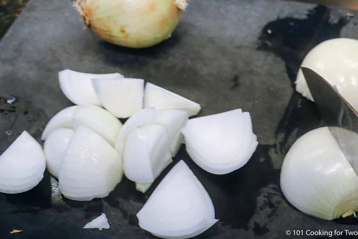 chopped onions on cutting board.