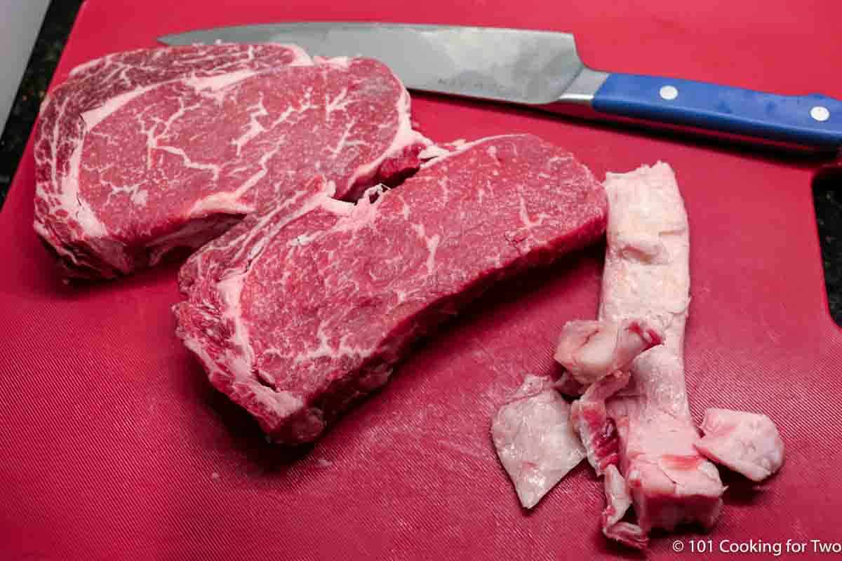 trim ribeyes of excess fat.